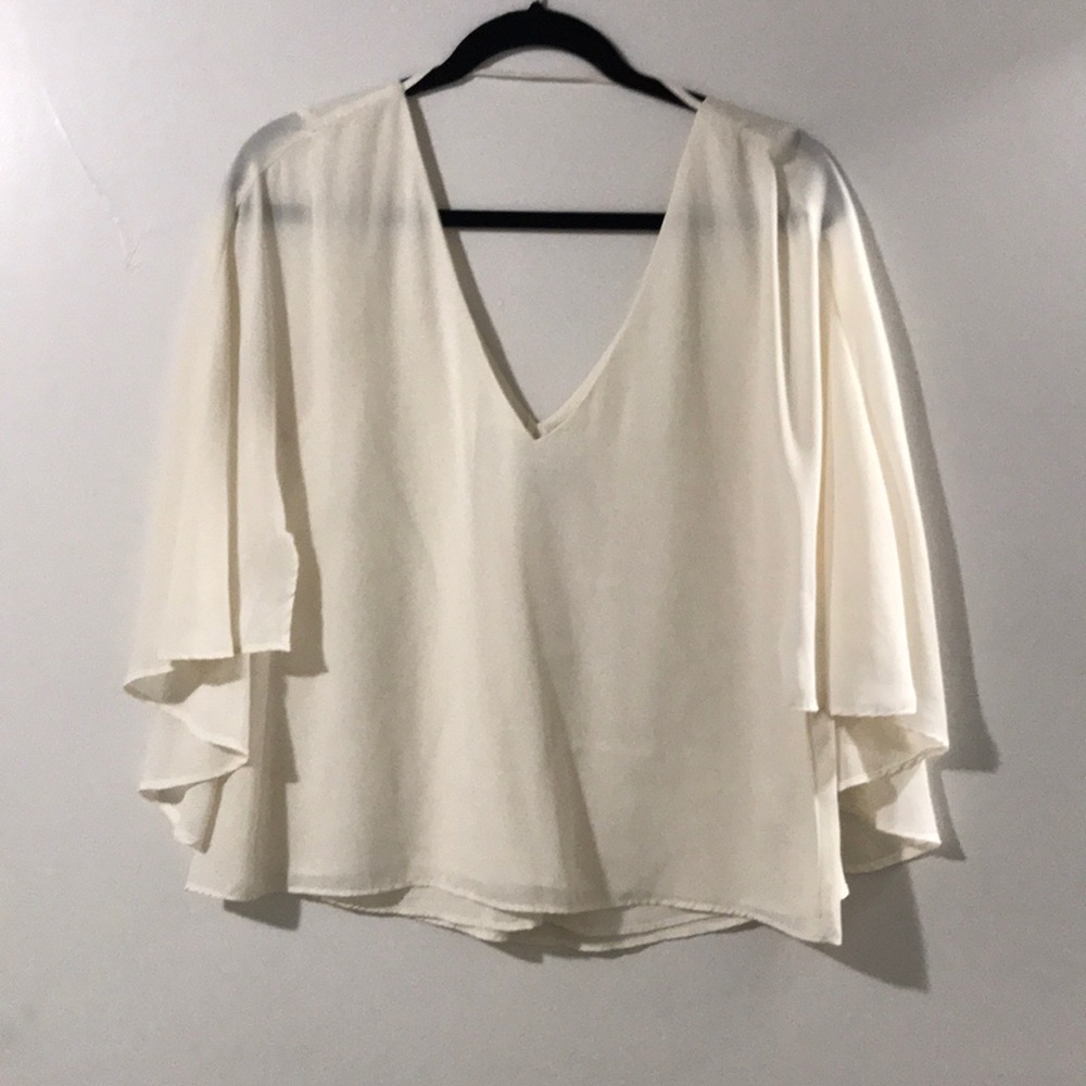 Cupcakes & Cashmere | cape style double v blouse